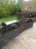 Load image into Gallery viewer, Outdoor kitchen with barbecue grill on a wooden deck

